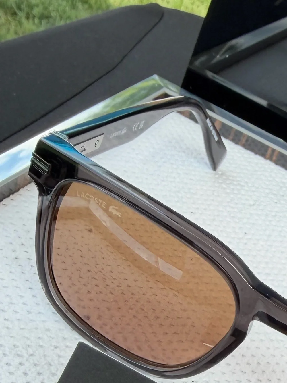 Lacoste Men’s Smoke Transparent Frame Sunglasses with Brown Lenses